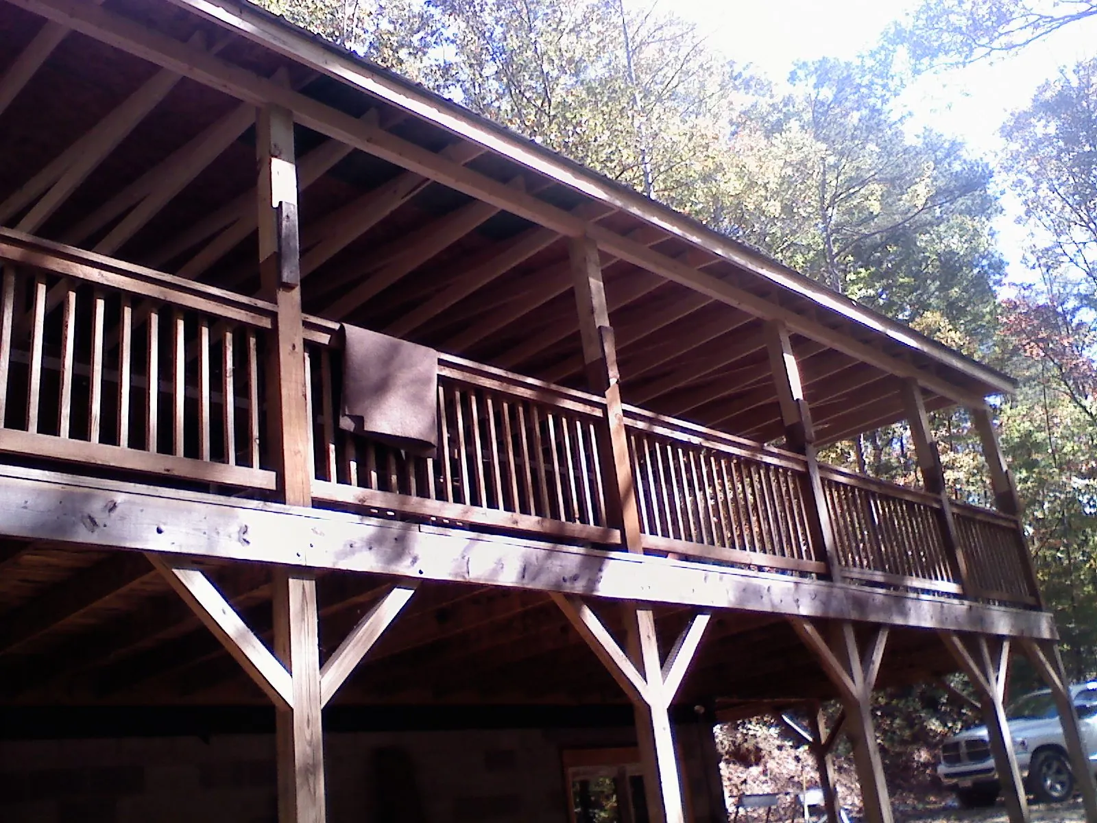 Timber framing under a new elevated porch and deck — Roof Leak Repair in San Antonio by Roofing Brothers